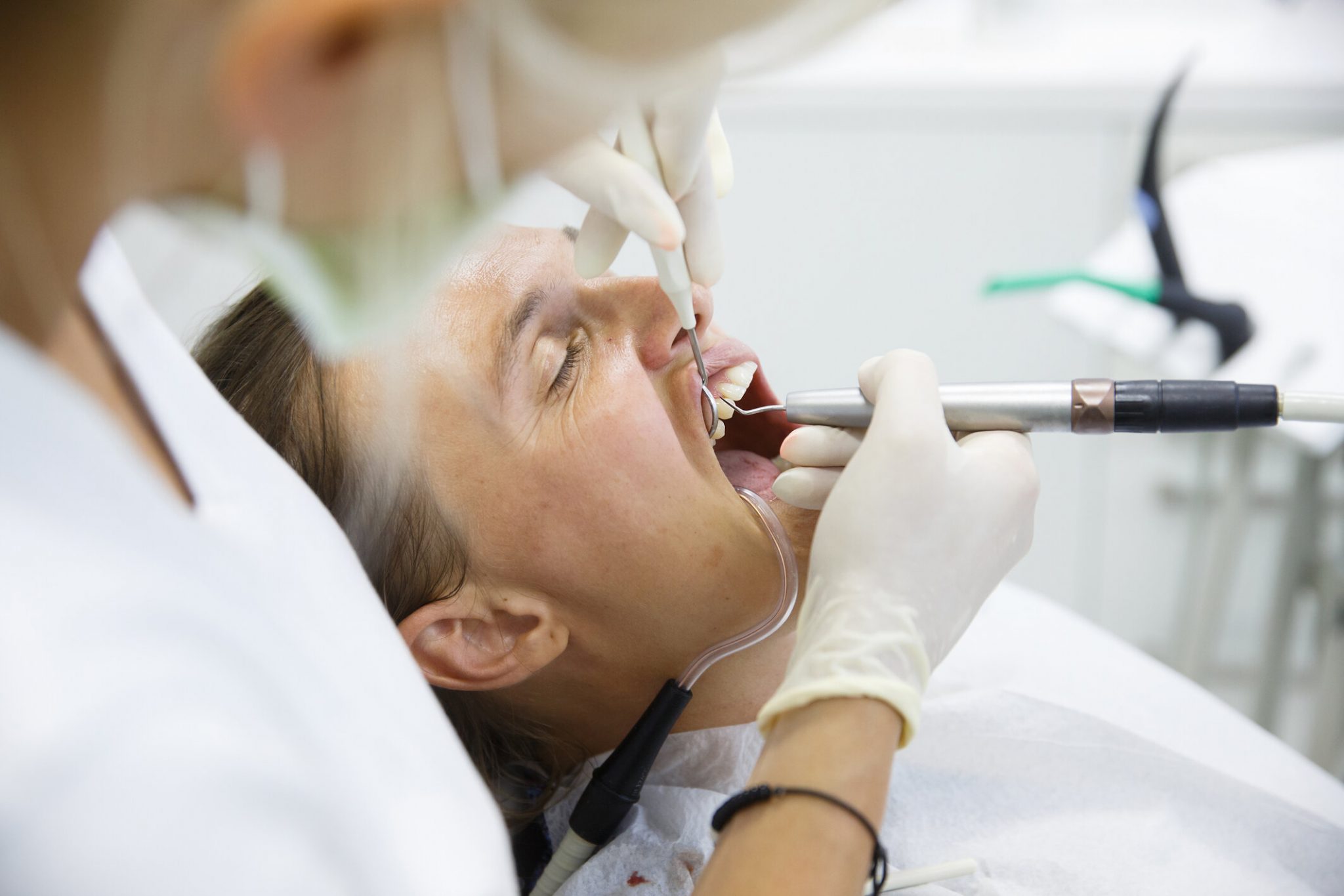 Patient getting her gum pocket depth measured Rocky Mountain